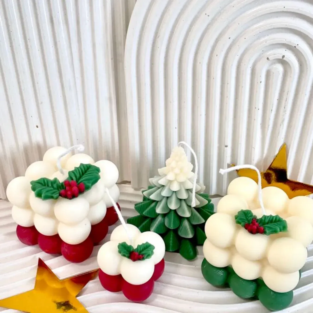 Velas navideñas de burbuja con acebo
